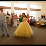 A new bride and groom dancing.
